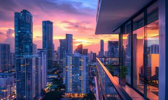A vibrant city skyline at dusk, with the sun setting behind skyscrapers, viewed from a modern apartment balcony photo