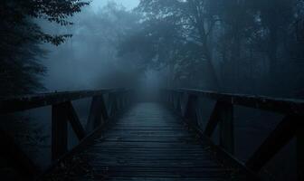 A foggy bridge leading into a dark forest with distant glowing eyes, leaving space at the bottom for text photo