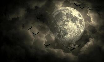 A full moon with eerie clouds and flying bats, with open space at the bottom for text photo