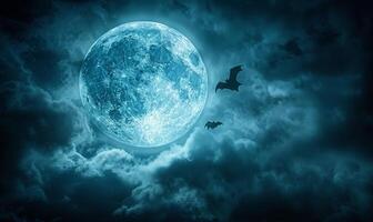 A full moon with eerie clouds and flying bats, with open space at the bottom for text photo
