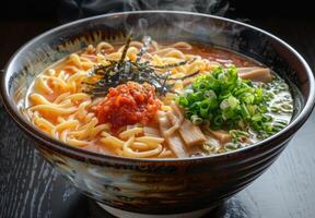A steaming bowl of ramen with perfectly cooked noodles, broth, and toppings photo
