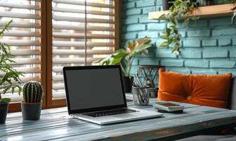 A stylish home office setup with a blank screen laptop and modern decor photo