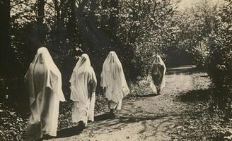 A vintage black-and-white Halloween photo with ghostly figures, leaving plenty of space on the right for a message