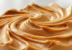 High-detail close-up of the smooth and creamy texture of peanut butter photo