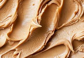 High-detail close-up of the smooth and creamy texture of peanut butter photo