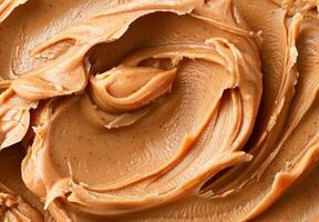 High-detail close-up of the smooth and creamy texture of peanut butter photo