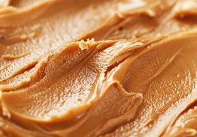 High-detail close-up of the smooth and creamy texture of peanut butter photo