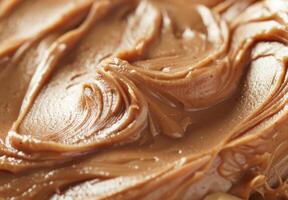 High-detail close-up of the smooth and creamy texture of peanut butter photo
