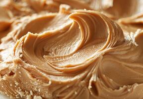 High-detail close-up of the smooth and creamy texture of peanut butter photo
