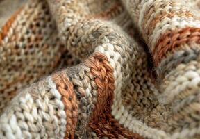 A close up of a knitted wool blanket, revealing the complex stitching and fiber details photo