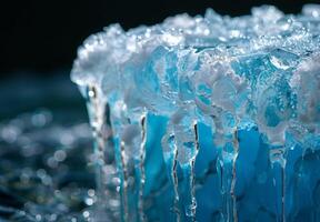 A close up of a melting glacier with clear water dripping down its surface photo
