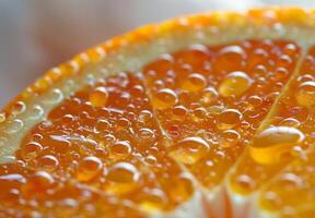 A close-up of an orange slice, focusing on the juicy texture and surface details photo