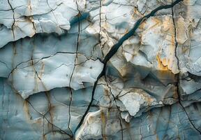A close up of a glacier with cracks and ice photo
