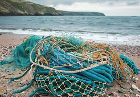 A pile of fishing nets on the beach photo