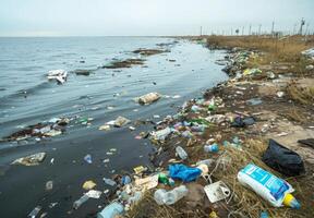A river with garbage and plastic floating in it photo