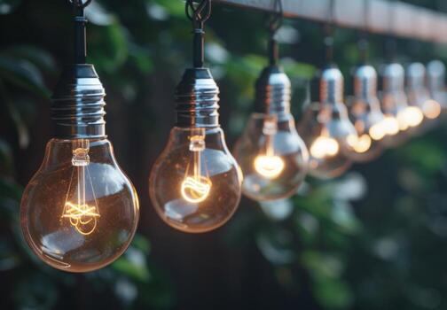 A string of light bulbs hanging from a wire photo
