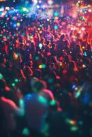 A crowd of people at a party with colorful lights photo