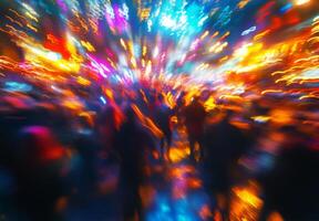 Blurred image of people walking in a city at night photo