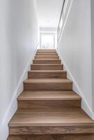 Minimalist staircase with sleek wooden steps, white walls, and a modern railing design photo