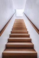 Minimalist staircase with sleek wooden steps, white walls, and a modern railing design photo