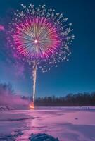 A vibrant fireworks display over a snowy landscape, creating contrast with the cold, dark surroundings photo