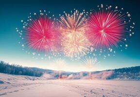 A vibrant fireworks display over a snowy landscape, creating contrast with the cold, dark surroundings photo