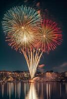 Bright fireworks exploding in the night sky over a cityscape, reflecting off nearby buildings and water photo