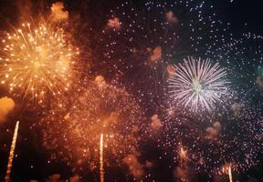 Fireworks bursting in the sky above a festive celebration, with shimmering sparks falling gracefully photo
