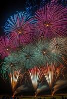 Multiple fireworks of different colors going off simultaneously, lighting up the night with vivid patterns photo