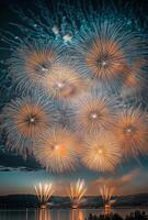 A spectacular finale of fireworks, with layers of colors and light filling the sky over a lake photo