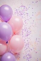 Soft pink and lavender balloons on the left side, paired with delicate confetti, leaving free space on the right for design elements photo