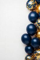 Elegant navy blue and gold balloons on the right side, with matching confetti, leaving a clean area on the left for customization photo