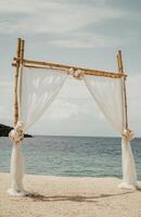 Wedding arch on the beach photo