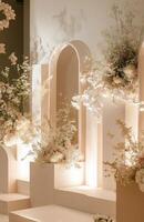 A stage with white pillars and flowers photo