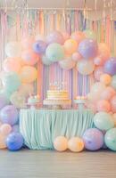 A colorful birthday setup with pastel balloons, a large cake table, and streamers hanging from the ceiling, creating a festive atmosphere photo