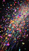 A vibrant scene of confetti fluttering through the air, with bold, colorful streaks of light illuminating the falling pieces against a deep black background photo