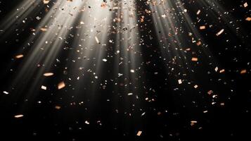 Abstract image of falling confetti illuminated by soft, scattered light rays, creating a magical and ethereal atmosphere over a black background photo