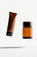 A floating cosmetic tube and jar set, both suspended side by side in mid-air, with a pure white background highlighting their shapes photo