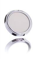 A flat cosmetic compact case levitating in mid-air, with clean edges and smooth reflections, isolated on a bright white background photo