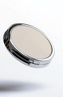 A flat cosmetic compact case levitating in mid-air, with clean edges and smooth reflections, isolated on a bright white background photo