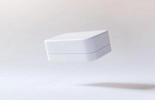 A simple, rectangular cosmetic jar hovering slightly above the surface, with subtle lighting and smooth edges, isolated on a white background photo