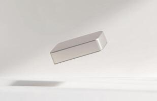 A simple, rectangular cosmetic jar hovering slightly above the surface, with subtle lighting and smooth edges, isolated on a white background photo