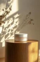 A plain, elegant cosmetic jar on a smooth wooden podium, with natural lighting creating gentle shadows on the product and surface photo