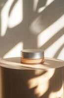 A plain, elegant cosmetic jar on a smooth wooden podium, with natural lighting creating gentle shadows on the product and surface photo