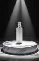 A white bottle of soap is on a marble pedestal photo