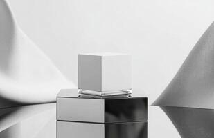 A white cube on top of a silver cube photo