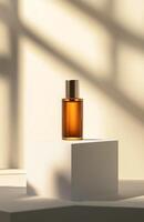 A bottle of perfume sits on a white pedestal photo