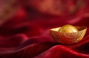 Golden egg on red cloth photo