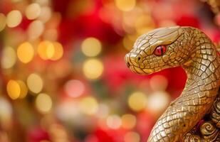 A golden snake statue with red eyes photo