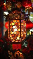 Snake scales reflecting light from a Chinese New Year lantern, surrounded by festive red and gold decorations photo